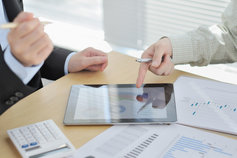 a man and woman having a discussion in an office