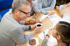 a group of people in a meeting