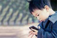 boy playing on a phone