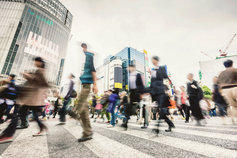 Pedestrians crossing busy street