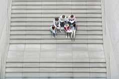 Group of students sitting on stairs