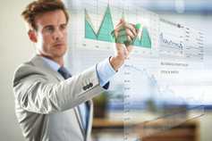 man drawing graph on clear wall