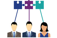 Icons of business people and jigsaw pieces