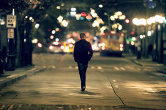 man walking down street