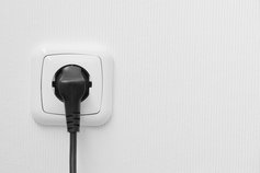 plug on white wall