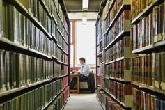 man studying in a library
