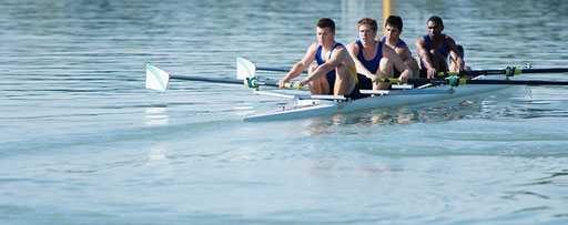 four men in a rowing boat