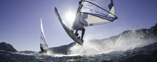 Man jumping with windsurf board