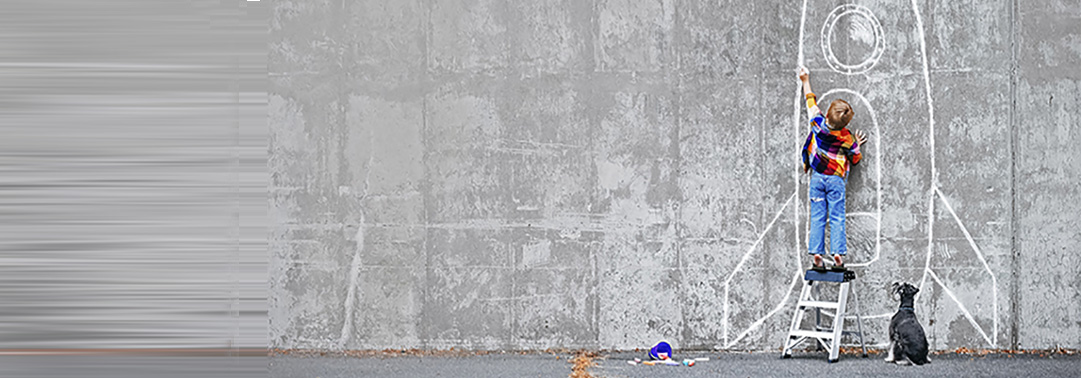 kid drawing aircraft on wall