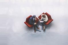 Overhead view of two business persons in the lobby