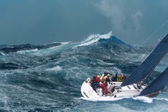 people on sailboat stormy weather