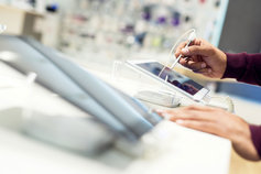 Hand holding stylus on touchscreen