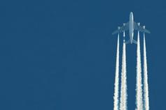 Fighter plane flying against blue background