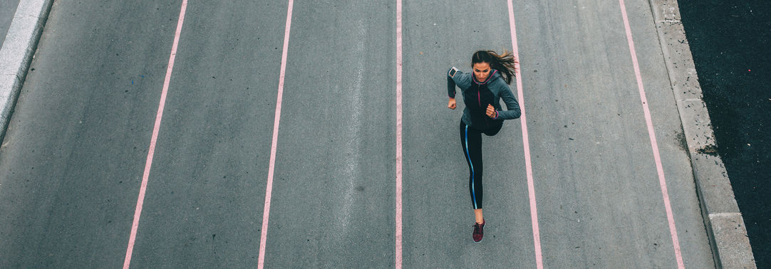Woman running on track