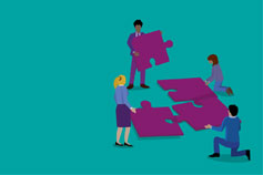 4 people with puzzle pieces on green background