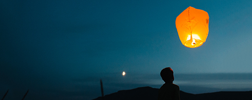 Lantern and man in moon light at night
