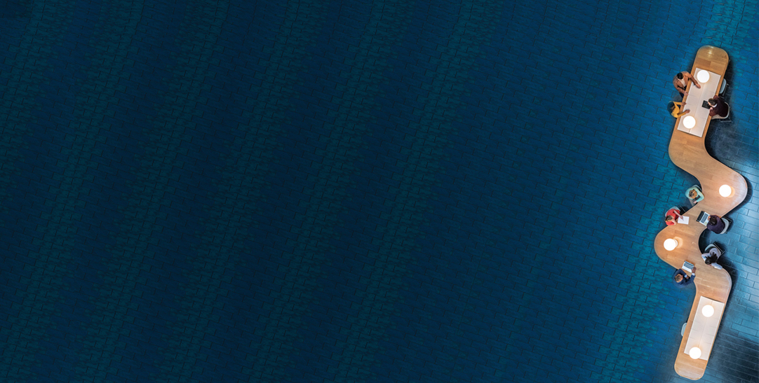 people sitting around a wooden table