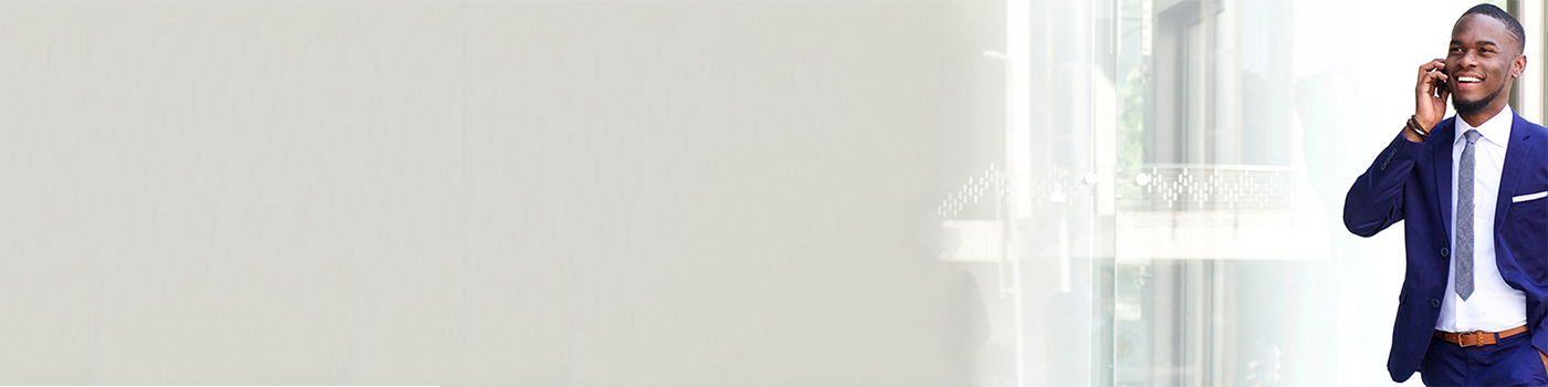 Man in blue suit talking on phone