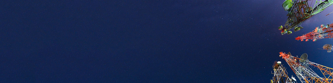 Telecom towers standing high below blue sky