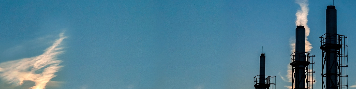 Three construction pillars with blue sky white and yellow clouds in the background