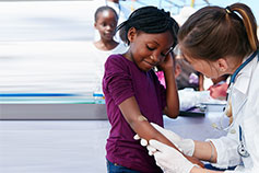 Doctor inspecting kid