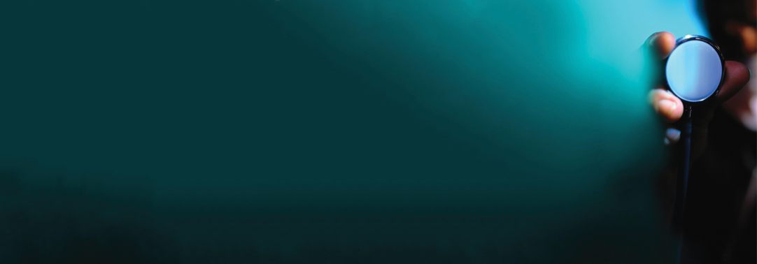 Hand holding stethoscope on green background