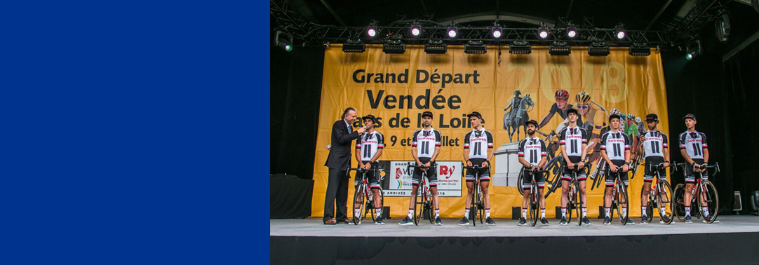 Sportsmen standing with cycle