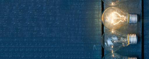 Light bulbs against wooden background