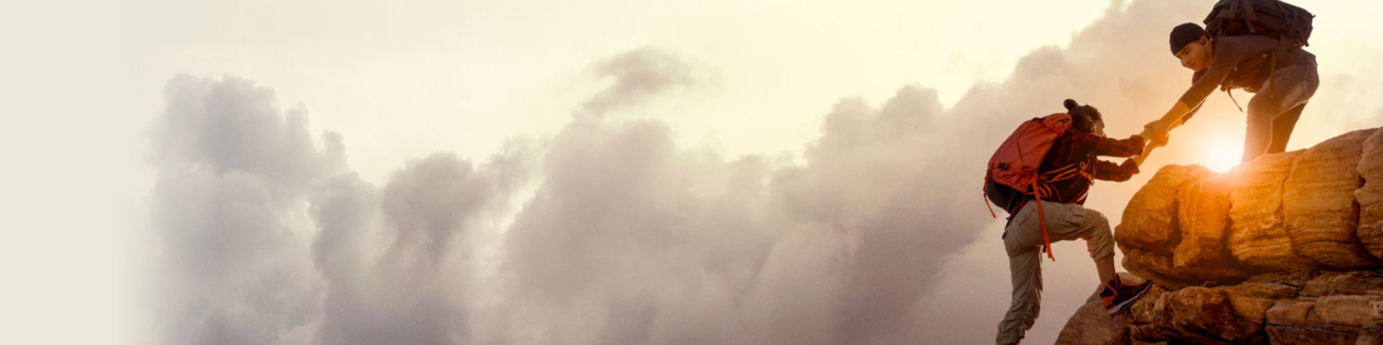 people helping each other climb