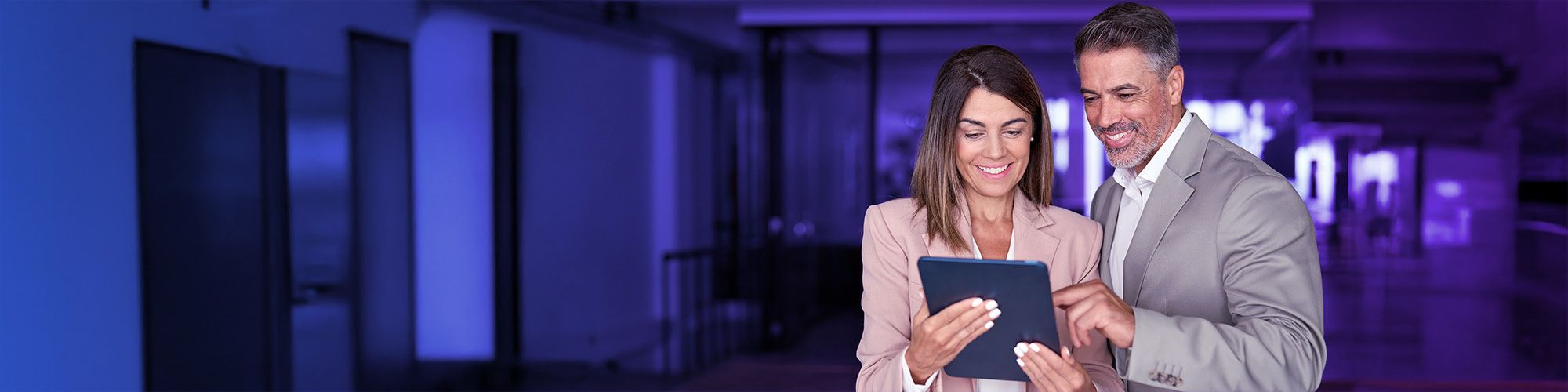 woman and man looking at tablet