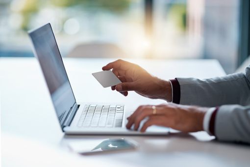 person looking at banking card