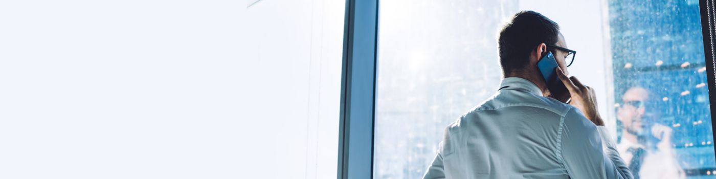 Businessman looking inside-out on mobile