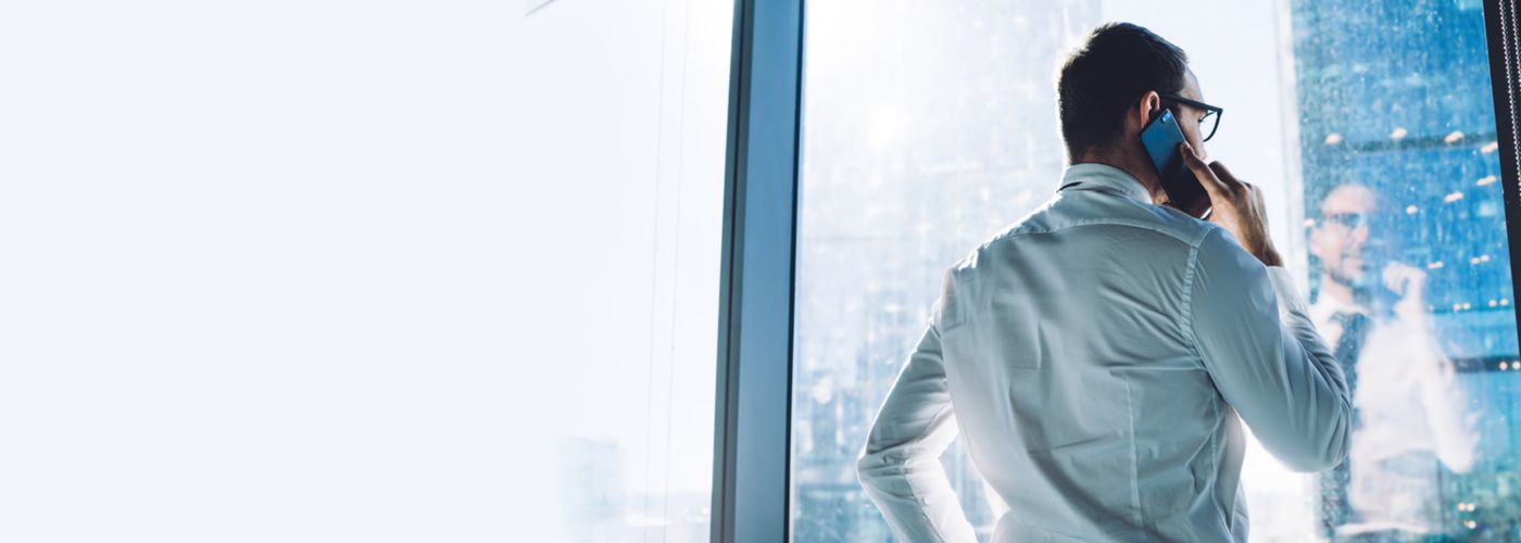 Businessman looking inside-out on mobile