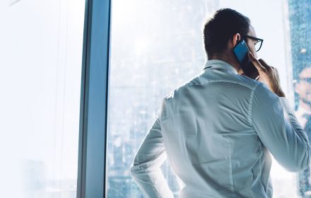 Businessman looking inside-out on mobile