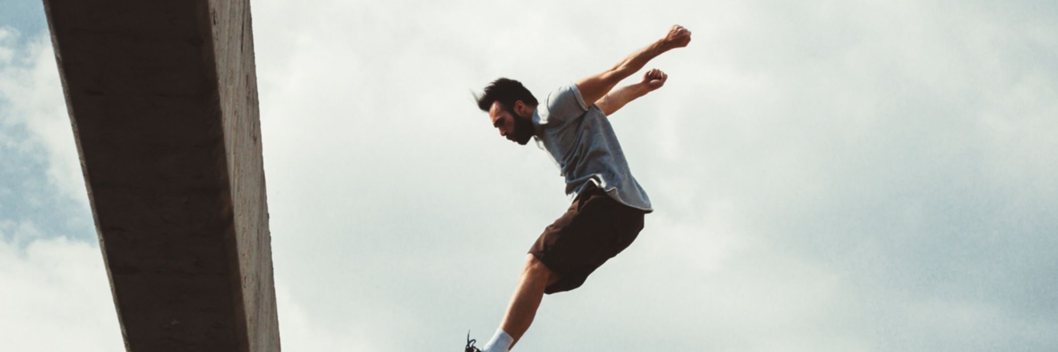 Man jumping over building