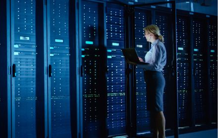 Business woman looking at data center
