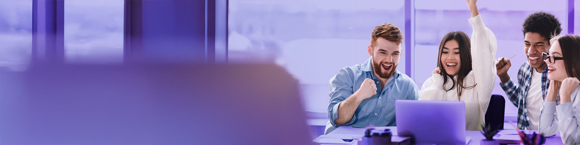 Young people having fun while working on a group project