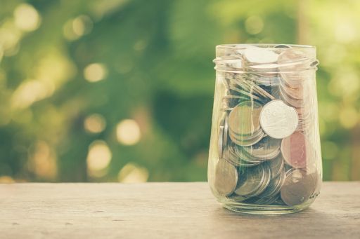 Coins in glass jar
