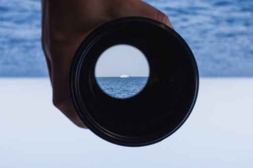 Binoculars in front of the sea
