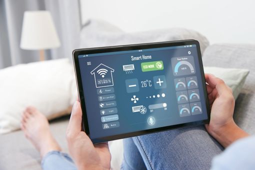 Woman reading smart home energy screen
