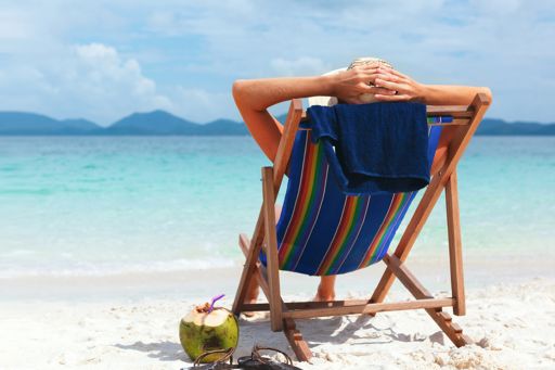 woman enjoying retirement on beach