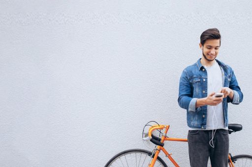 Man standing next to bicycle
