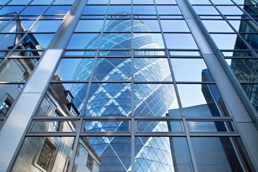 KPMG IFRS for banks topic image: London's 'Gherkin' building reflected in a pane of glass