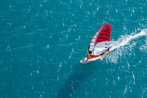 High angle image of a windsurfer on the open water 