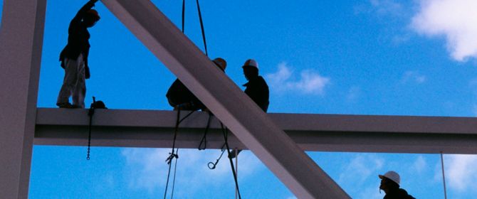 KPMG IFRS Conceptual Framework topic image: Close-up of workers on a building site scaffold.