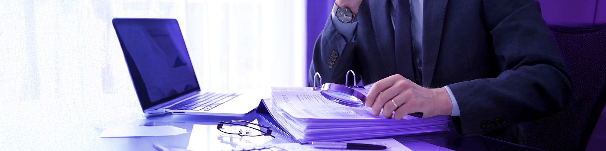 Paper and a magnifying glass