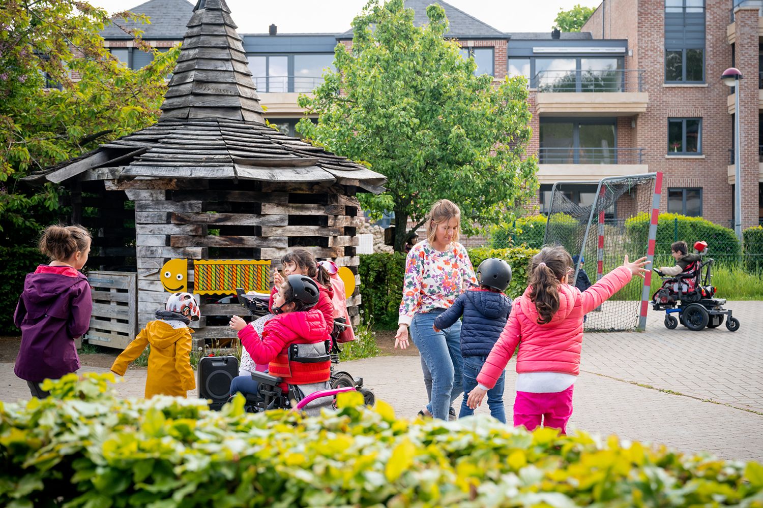 children from Escalpade playing outside in the playground