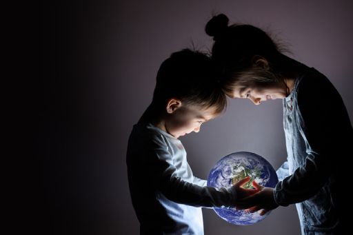 children holding planet