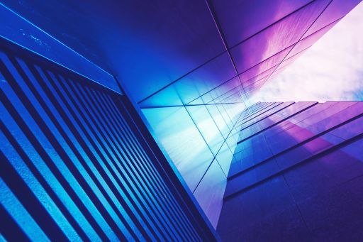 Insurance Insights - blue purple gradient over corporate glass buildings