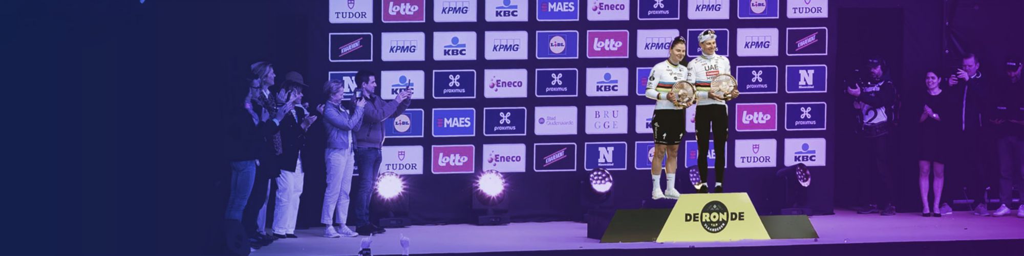 Female and male winner of the Tour of Flanders standing together on the podium